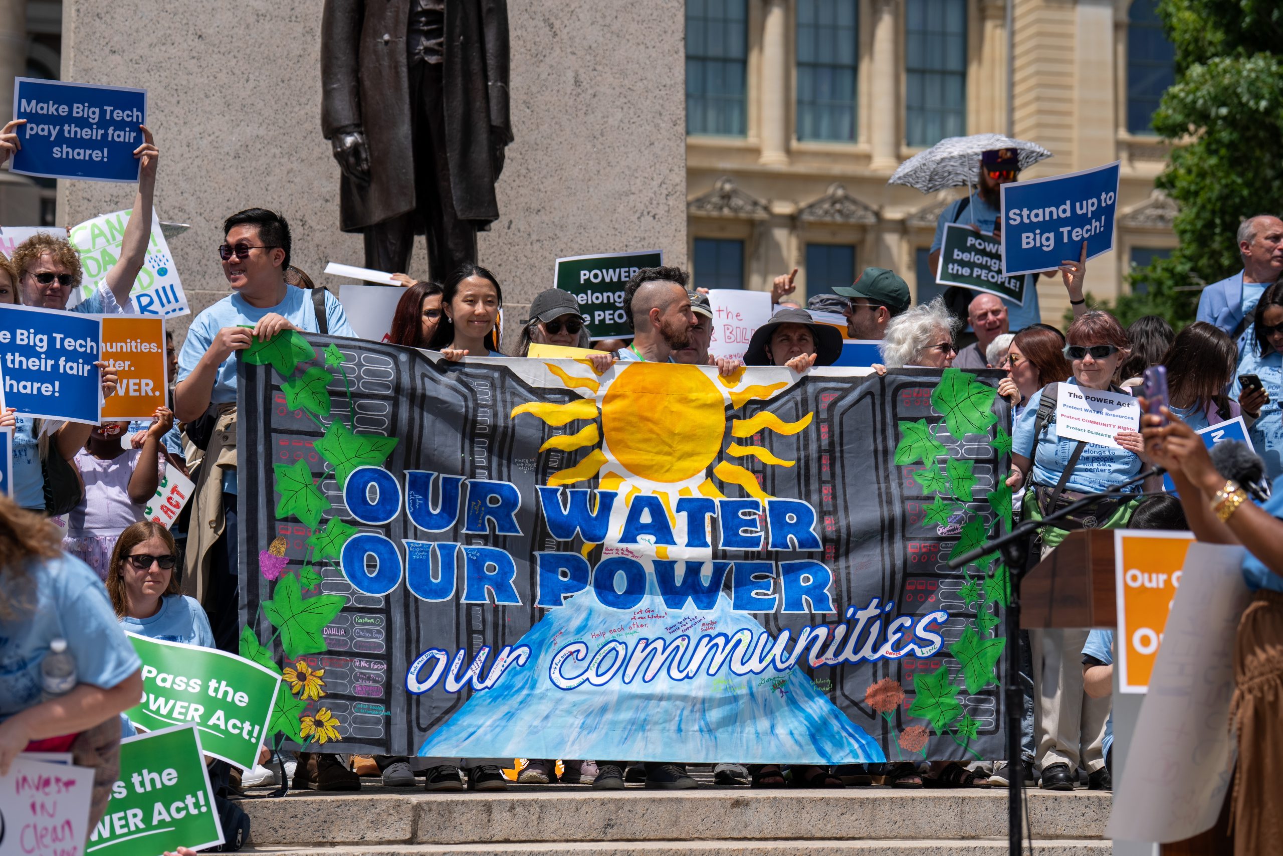 lobby day participants hold a banner in front of the Capitol